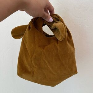 MERIT Beauty Corduroy Knot Handle Bag in Mustard